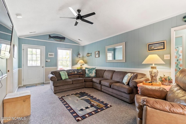 carpeted living room featuring lofted ceiling and ceiling fan