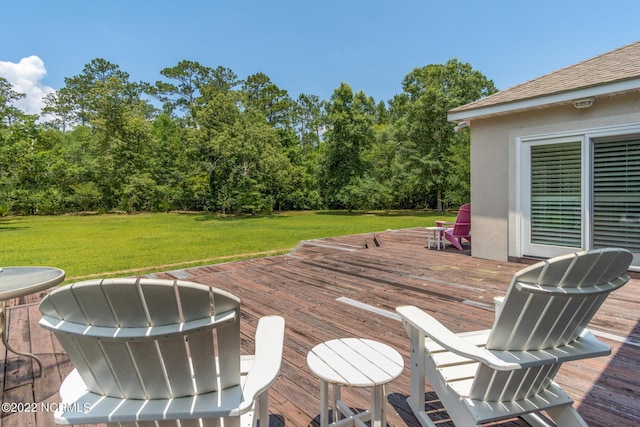 wooden deck with a yard