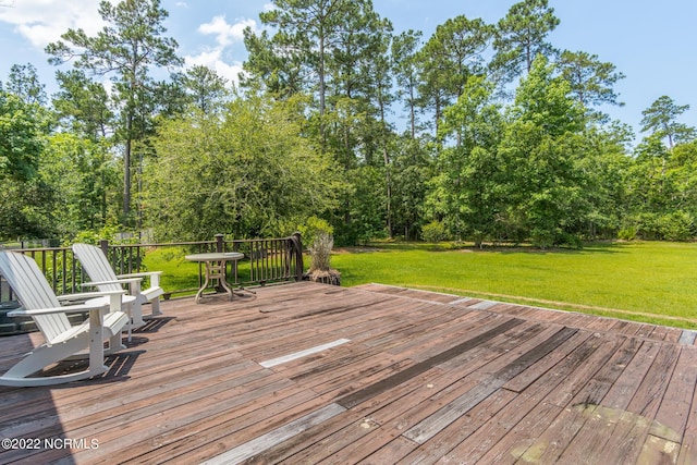 wooden deck with a yard