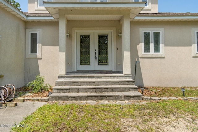 entrance to property featuring french doors