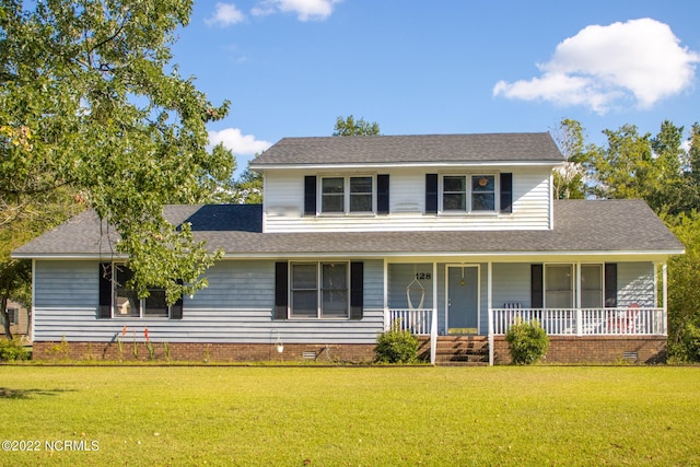 view of front of property featuring a front yard and a porch