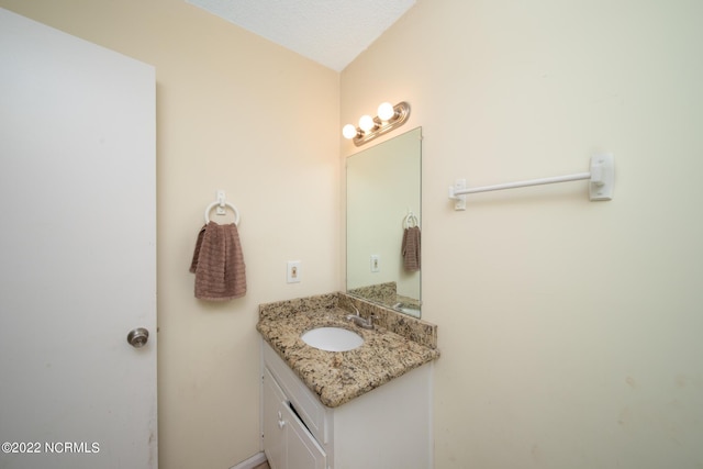 bathroom with vanity with extensive cabinet space