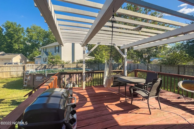 deck with a yard and a pergola