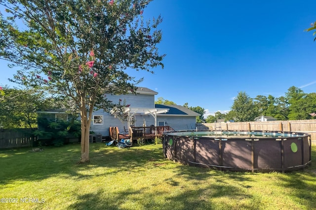 view of yard featuring a pool side deck