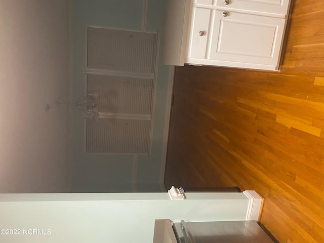 bathroom with wood-type flooring