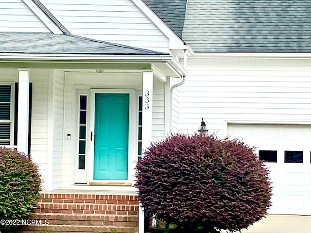 doorway to property with covered porch