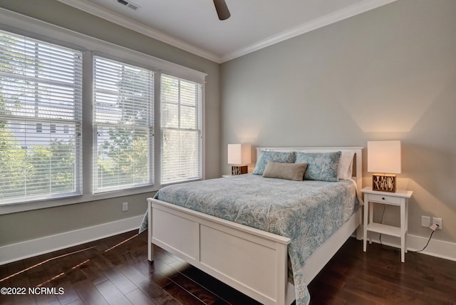 bedroom with dark hardwood / wood-style floors, ceiling fan, and ornamental molding