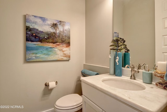 bathroom with toilet and vanity