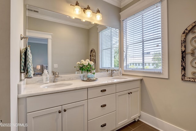 bathroom featuring dual bowl vanity, ornamental molding, and tile floors