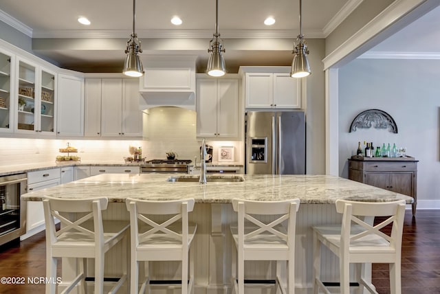 kitchen with dark hardwood / wood-style floors, tasteful backsplash, decorative light fixtures, and stainless steel refrigerator with ice dispenser