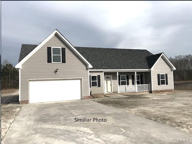 single story home with covered porch and a garage