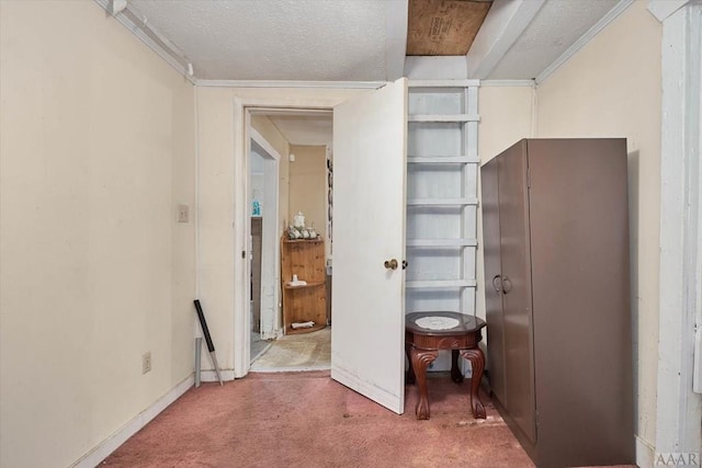 unfurnished bedroom with carpet flooring and a textured ceiling