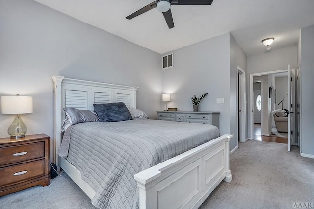 bedroom with light carpet and ceiling fan