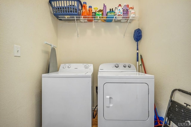 washroom featuring washer and dryer and wood-type flooring