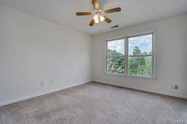 unfurnished room featuring ceiling fan and light colored carpet