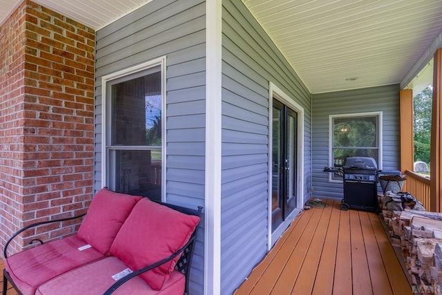 wooden deck with grilling area