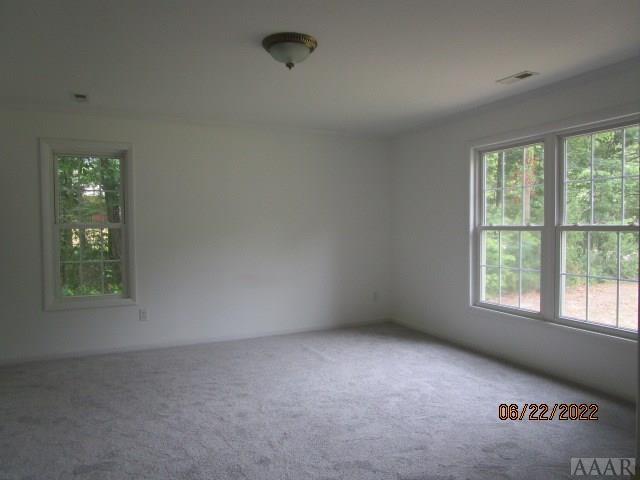 empty room featuring carpet floors