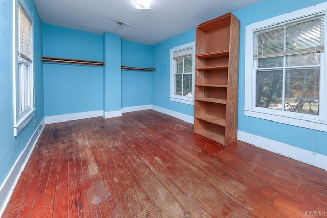 spacious closet with dark hardwood / wood-style floors