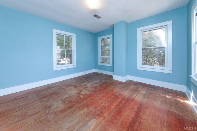 empty room featuring dark hardwood / wood-style floors