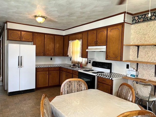 kitchen with dark tile flooring, white appliances, ornamental molding, and sink