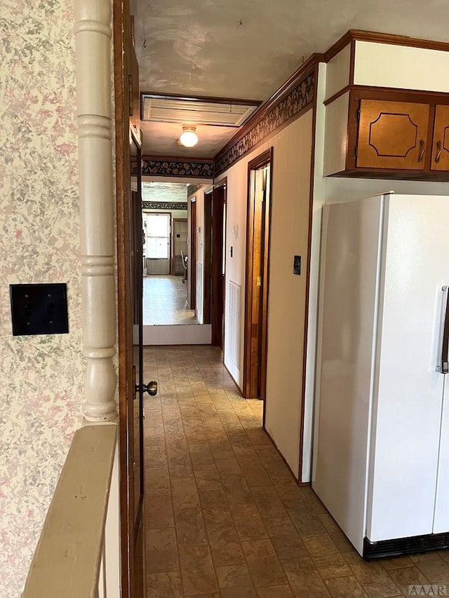 corridor with dark tile flooring