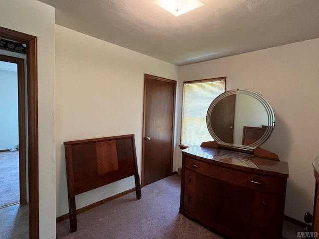 bedroom featuring dark colored carpet