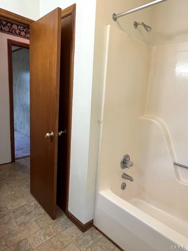 bathroom featuring  shower combination and tile floors