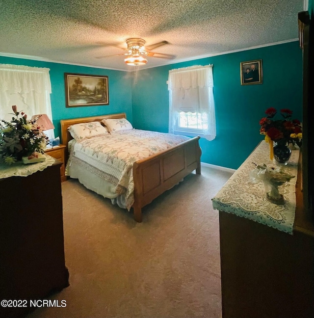 carpeted bedroom featuring a textured ceiling and ceiling fan