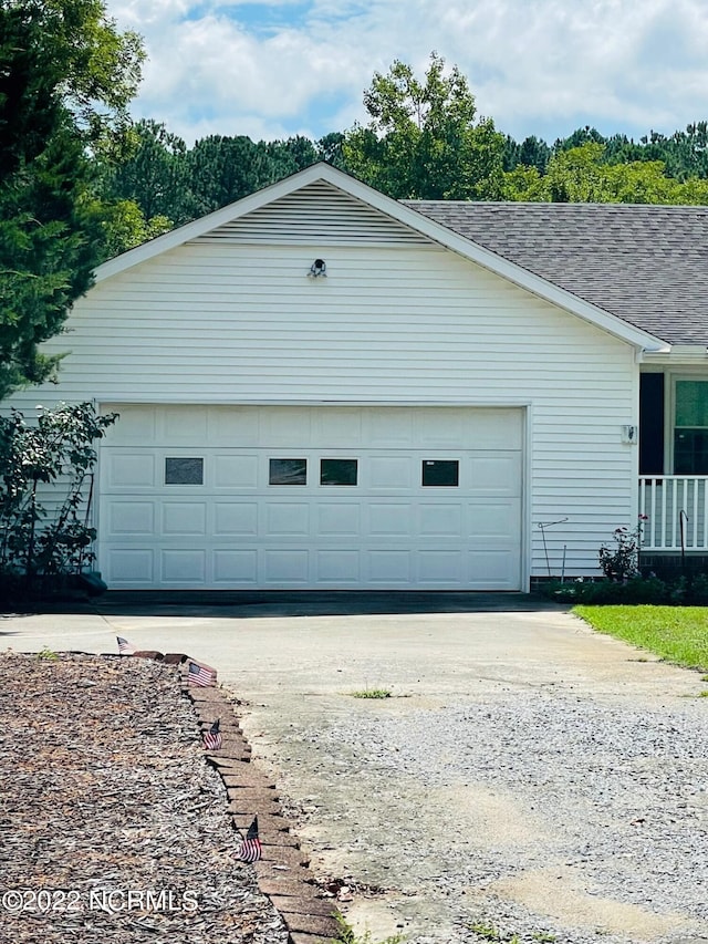 view of side of property with a garage