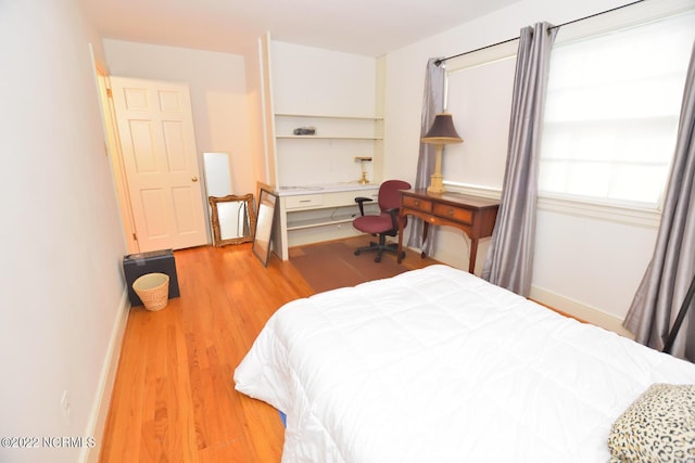 bedroom featuring light wood-type flooring