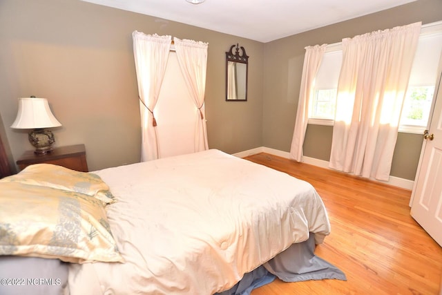 bedroom with light hardwood / wood-style floors