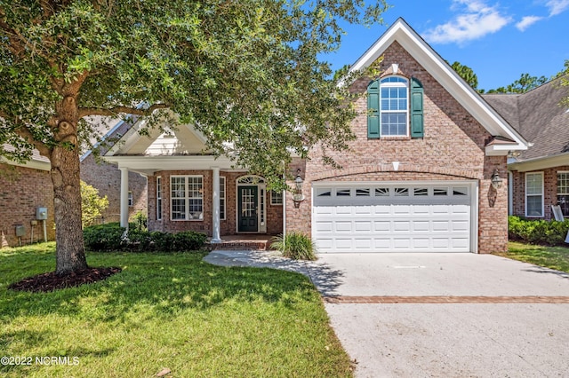 view of property featuring a front lawn and a garage