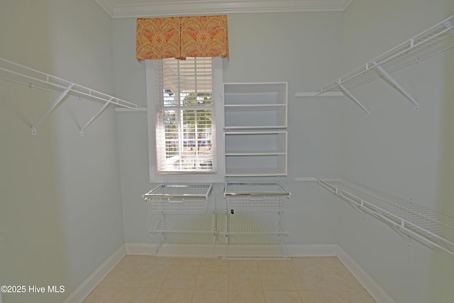 walk in closet with tile patterned flooring