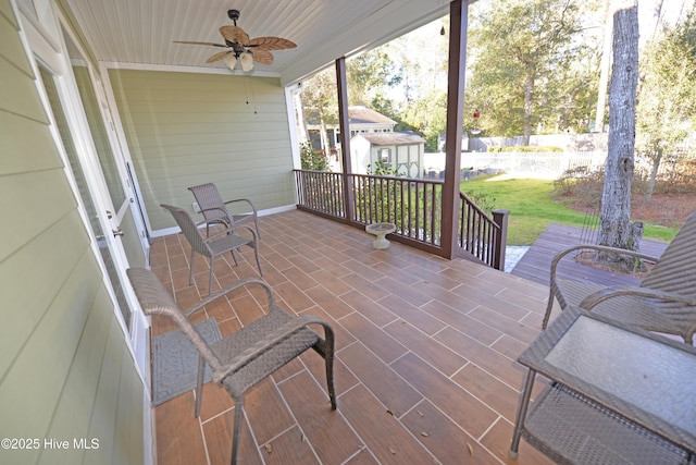 view of patio / terrace with an outbuilding and a ceiling fan