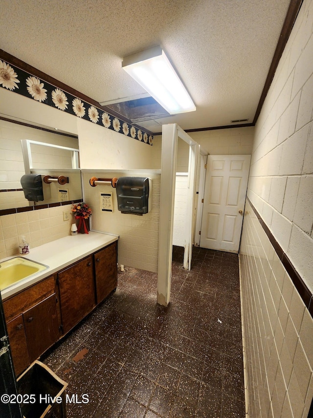 bathroom featuring vanity and a textured ceiling