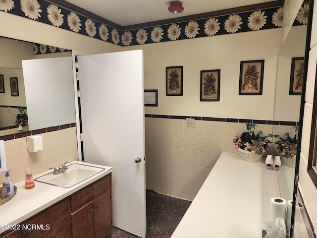 bathroom with tile walls and vanity