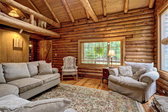 living room featuring vaulted ceiling with beams, log walls, wooden ceiling, and light hardwood / wood-style flooring