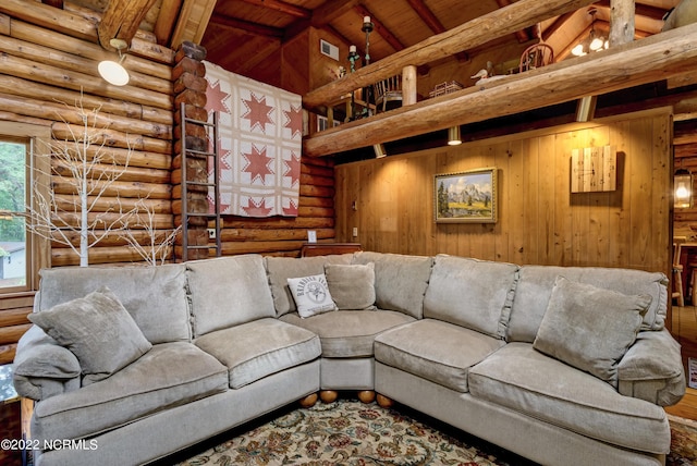 living room featuring hardwood / wood-style floors, beamed ceiling, rustic walls, wood ceiling, and high vaulted ceiling