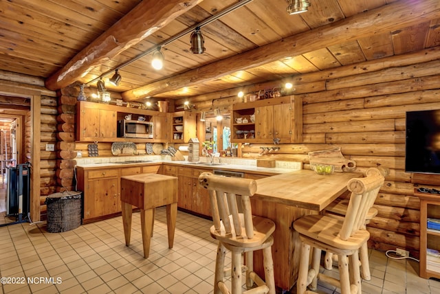 kitchen featuring log walls, beamed ceiling, wood ceiling, and light tile floors