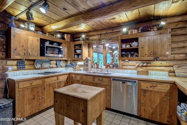 kitchen featuring light tile flooring, beamed ceiling, stainless steel appliances, log walls, and wood ceiling