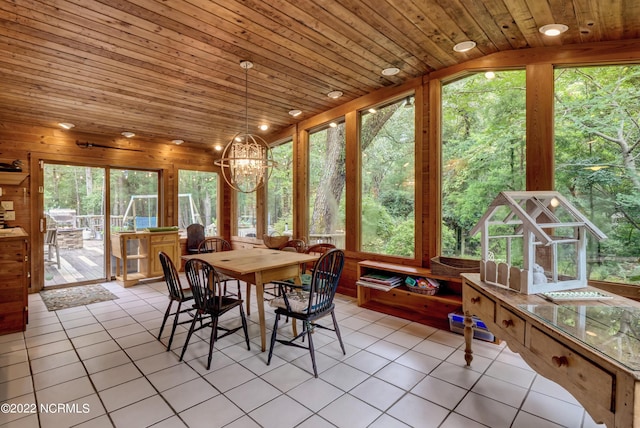 sunroom / solarium featuring wooden ceiling and an inviting chandelier