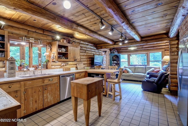 kitchen with stainless steel dishwasher, beam ceiling, wood ceiling, and light tile floors