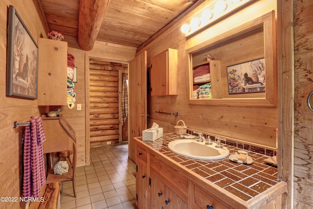 bathroom with tile floors, log walls, wood walls, wood ceiling, and large vanity