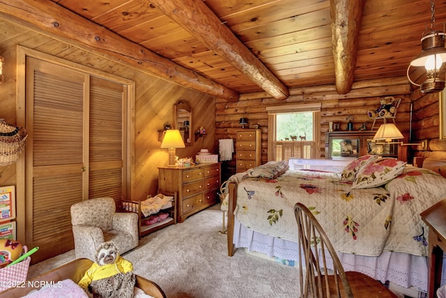 carpeted bedroom with rustic walls, wooden ceiling, a closet, and beamed ceiling