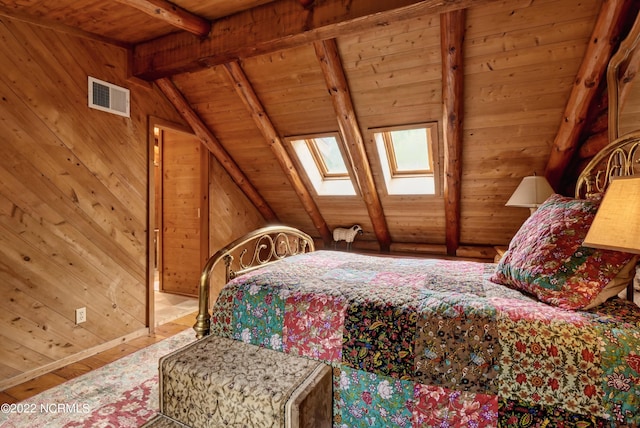 bedroom featuring lofted ceiling with skylight, wooden walls, wood ceiling, and hardwood / wood-style floors