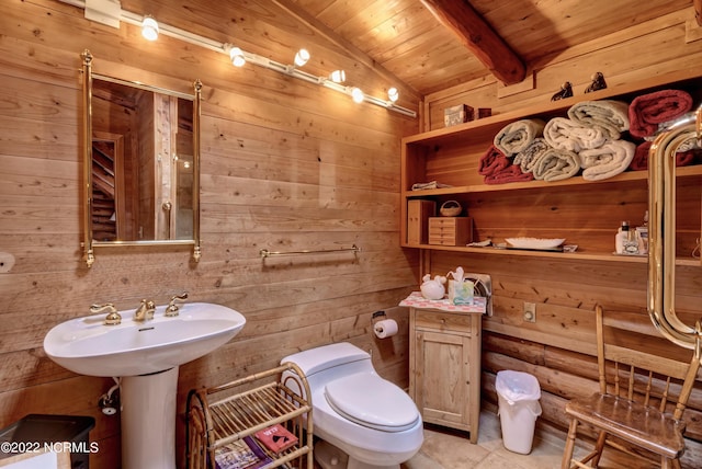 bathroom featuring wooden ceiling, toilet, wood walls, and tile flooring