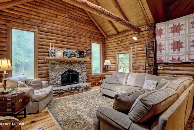 living room featuring log walls, wood ceiling, high vaulted ceiling, a stone fireplace, and light wood-type flooring