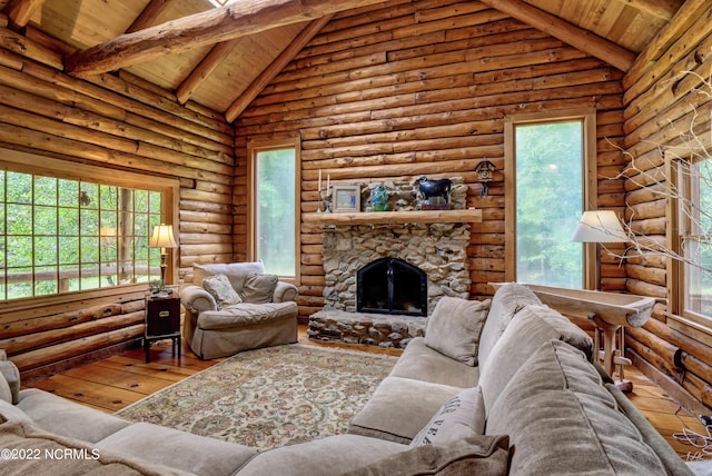 living room with light wood-type flooring, rustic walls, and wooden ceiling