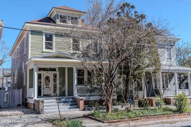 traditional style home featuring covered porch