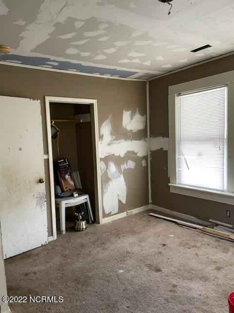 304 E Academy St, Robersonville, NC 27871 - view of carpeted spare room